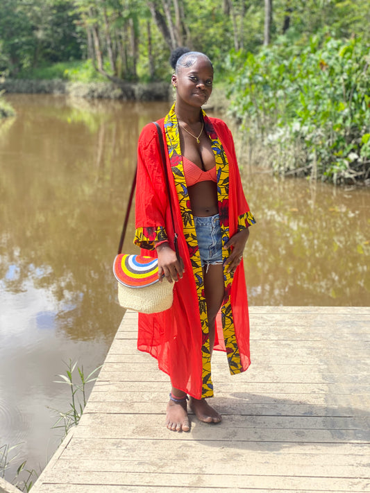 Kimono orangia fluide est un accessoire idéal autant pour vos sorties à  la plage, la crique , une soirée autour de la piscine que pour une journée de travail dans la clim